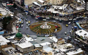 نمایی از منطقه فردیس کرج، با خیابان‌های پرتردد و ساختمان‌های مسکونی و تجاری.